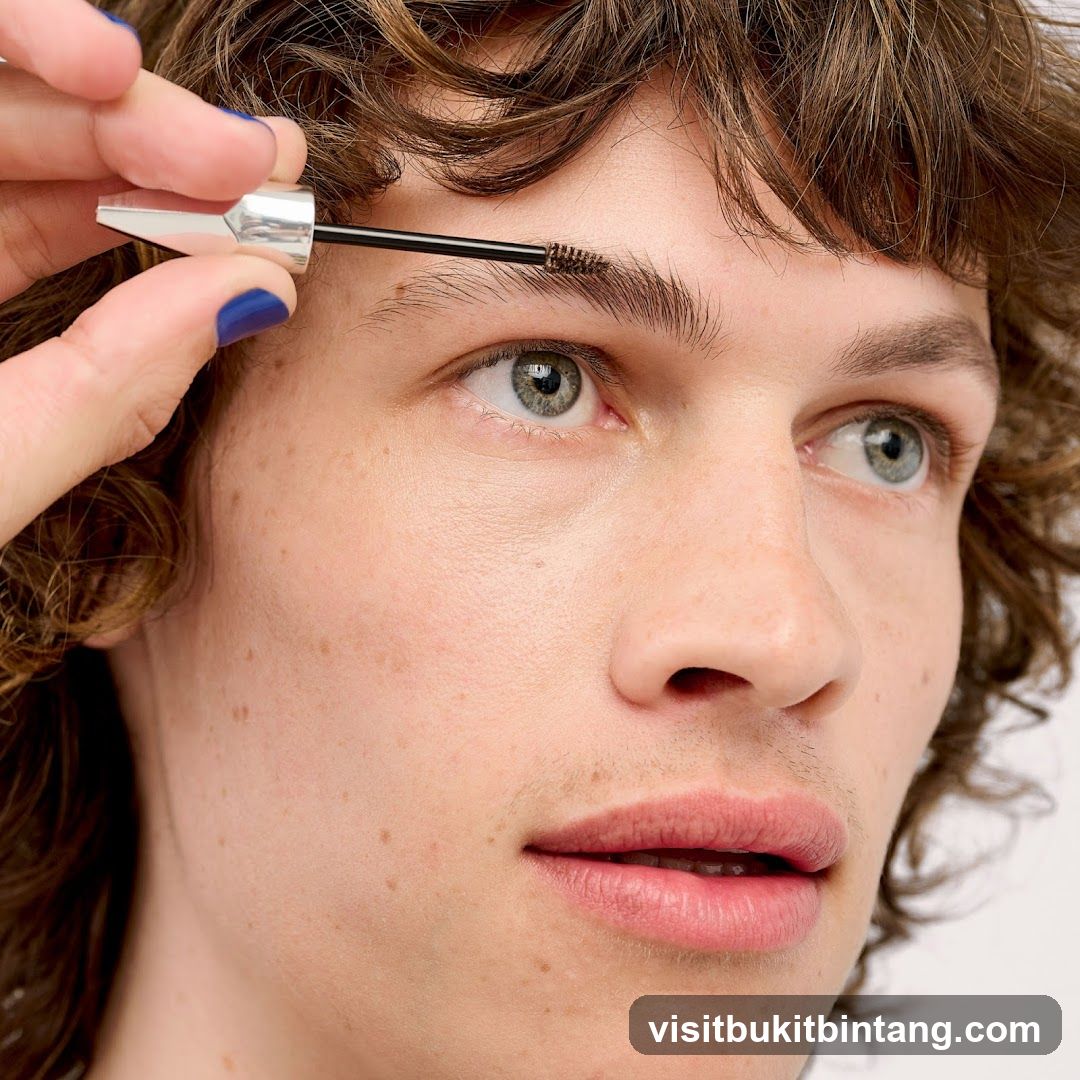 Close-up of person applying mascara