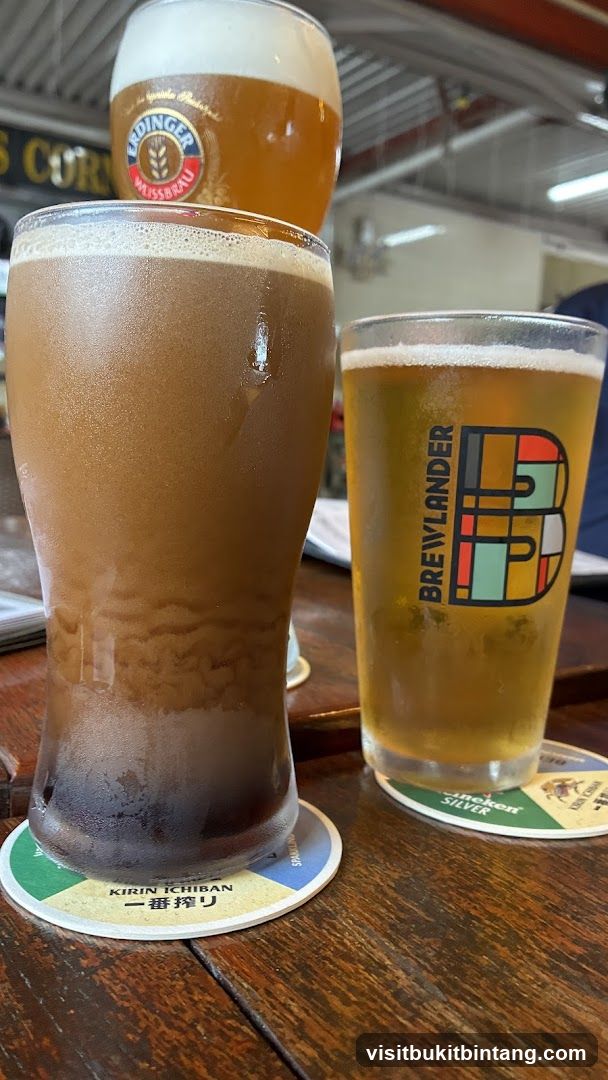 Three glasses of beer on a wooden table