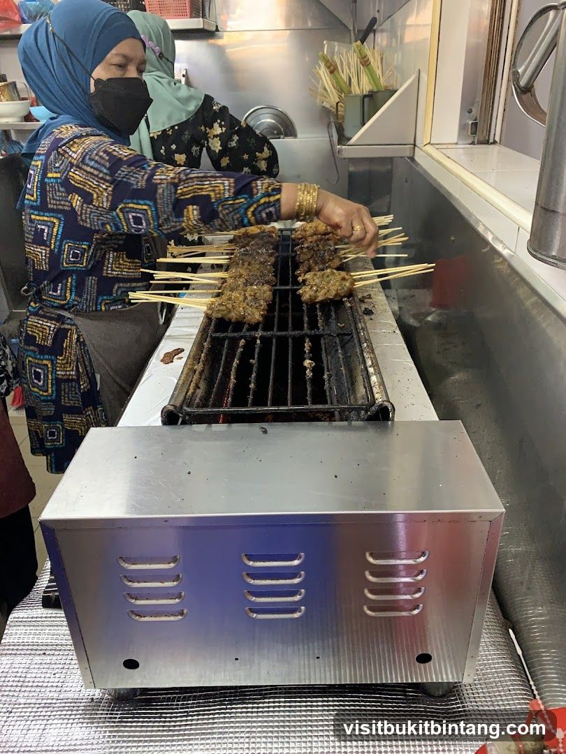 Satay being grilled