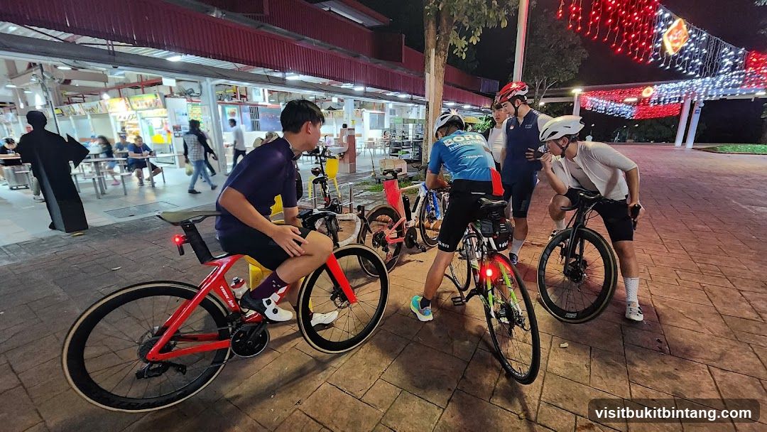 Cyclists gathered at a food court