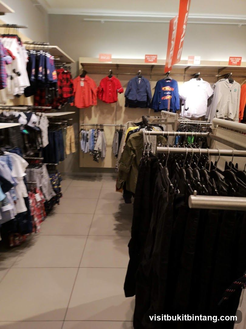Clothing store aisle with sale signs