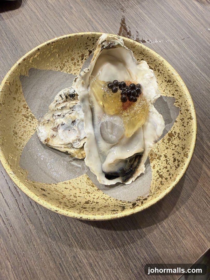 Oyster with Caviar on Gold Plate