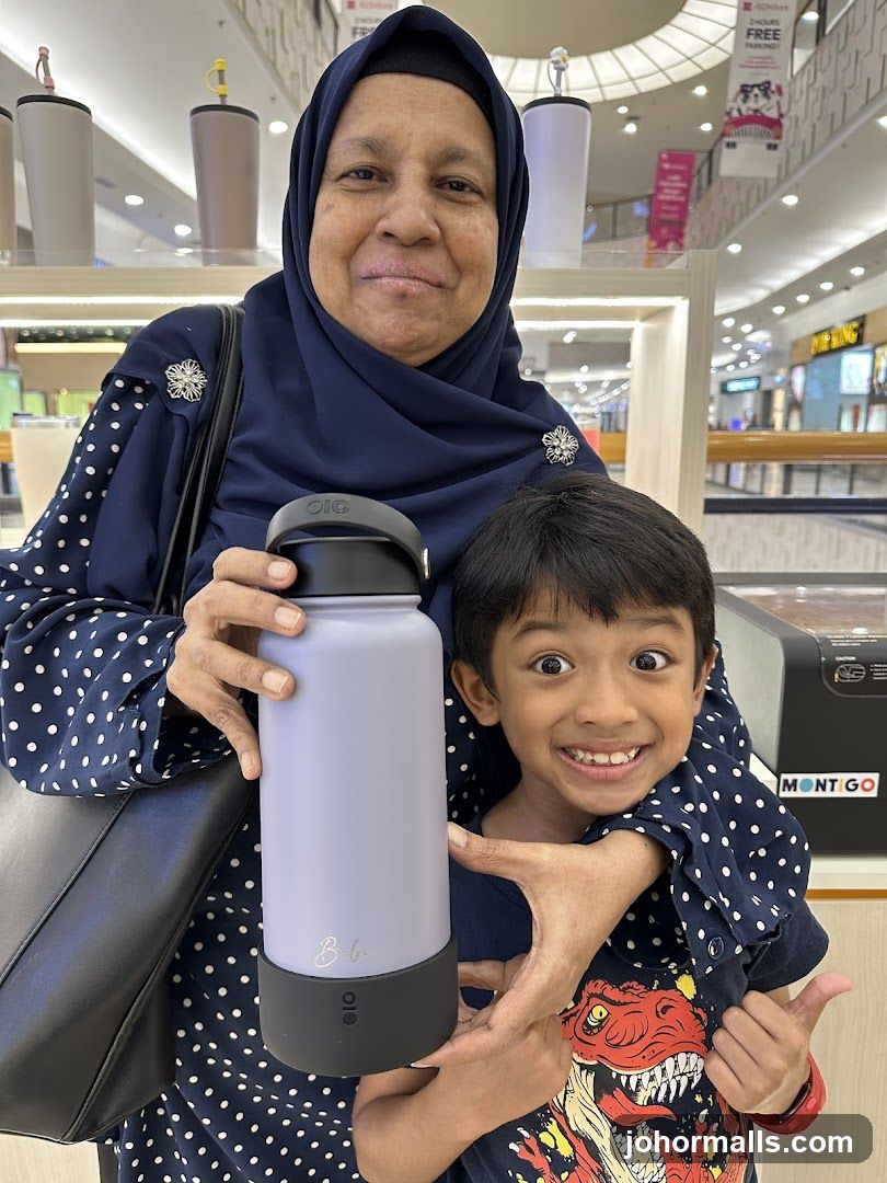 Woman and Child Holding a Water Bottle