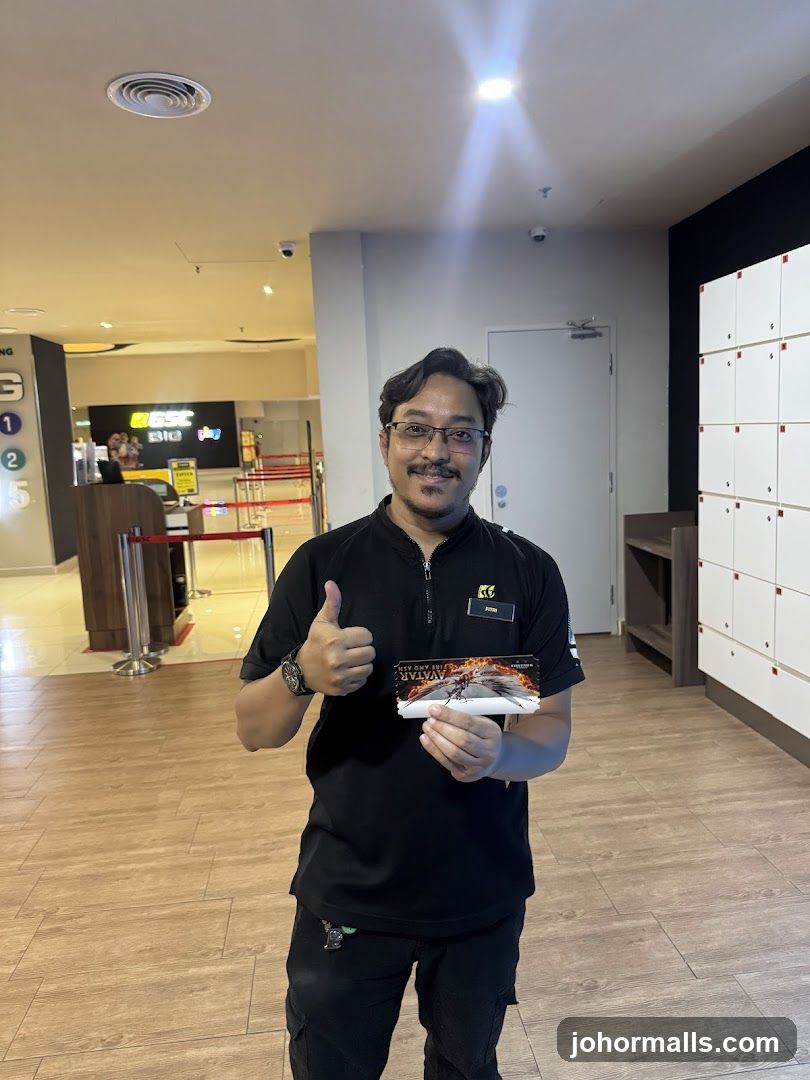 Man holding movie ticket