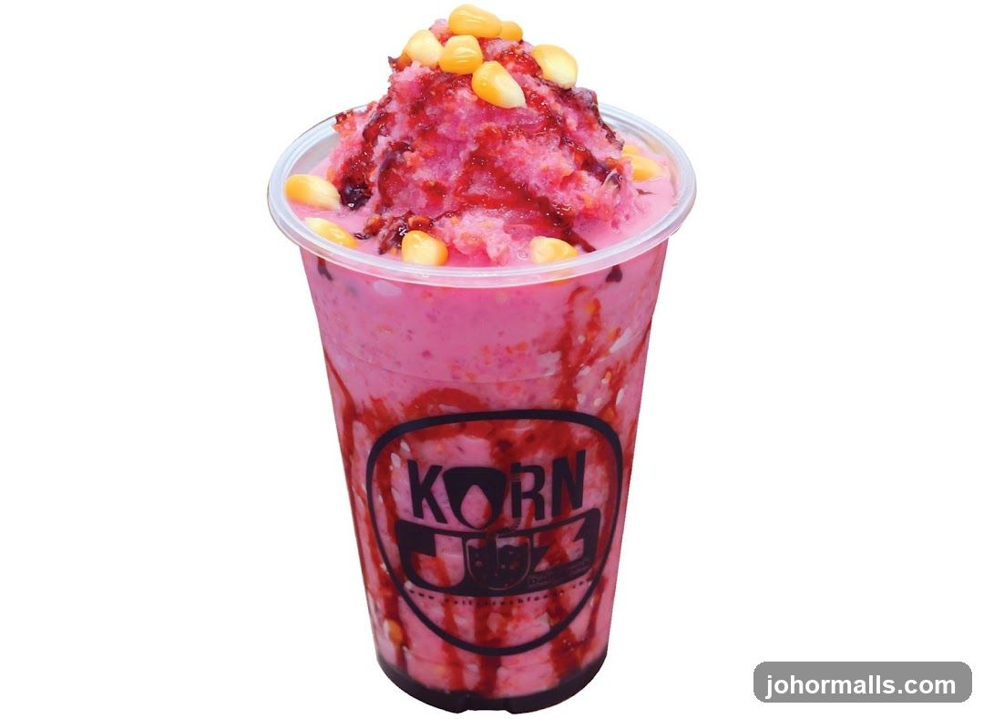 Pink shaved ice drink with corn and syrup