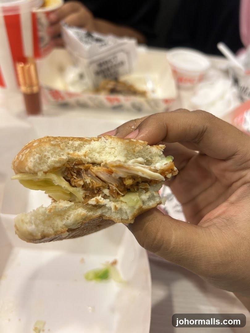 Hand holding burger