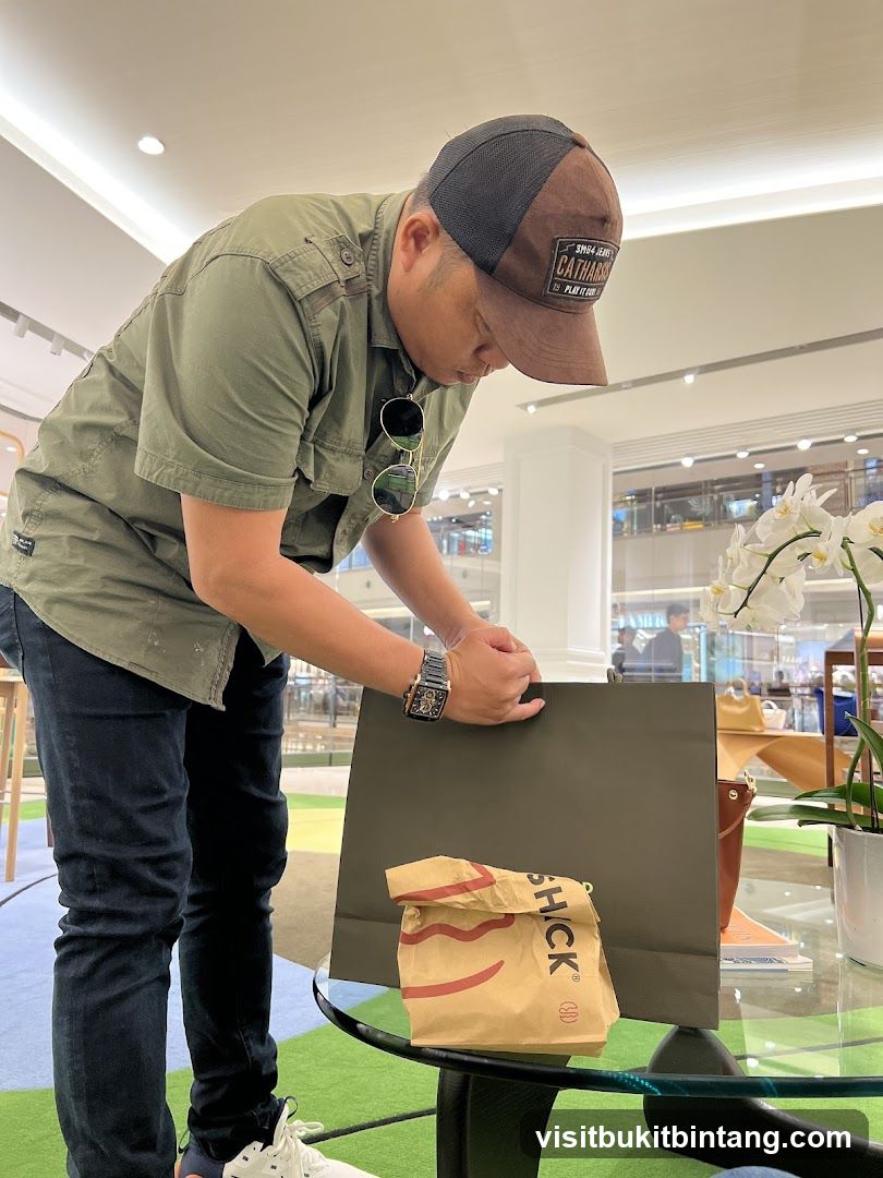 Man with shopping bags in mall