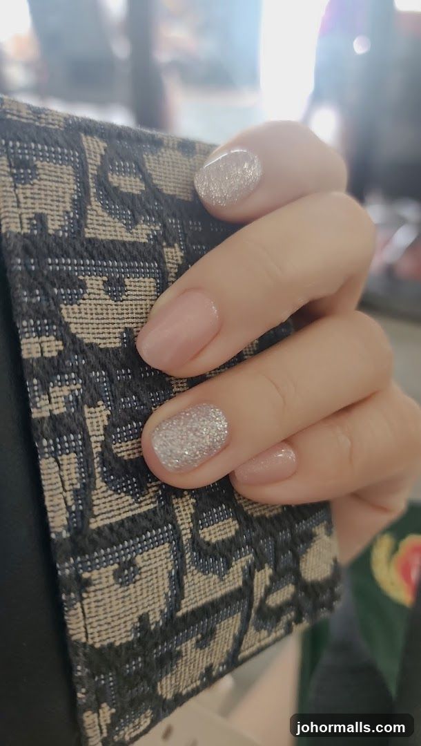 Nails with Glitter and Nude Polish