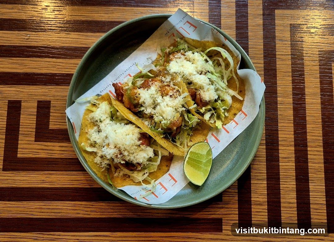 Three Tacos with Lime Wedge