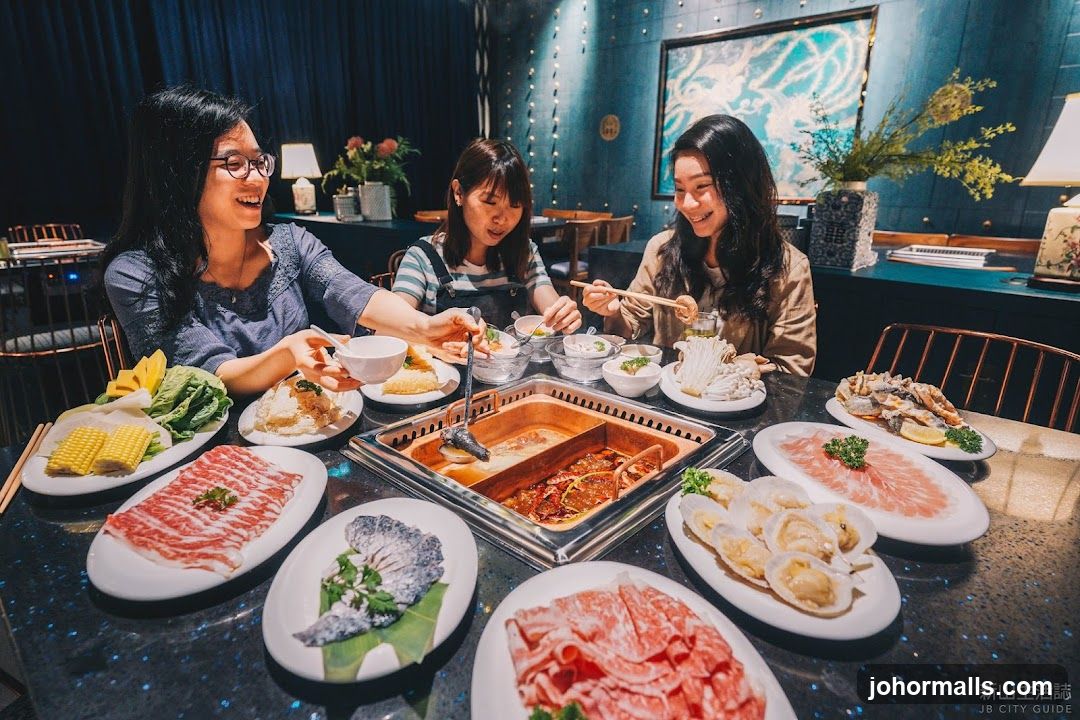 Friends Enjoying Hot Pot Meal