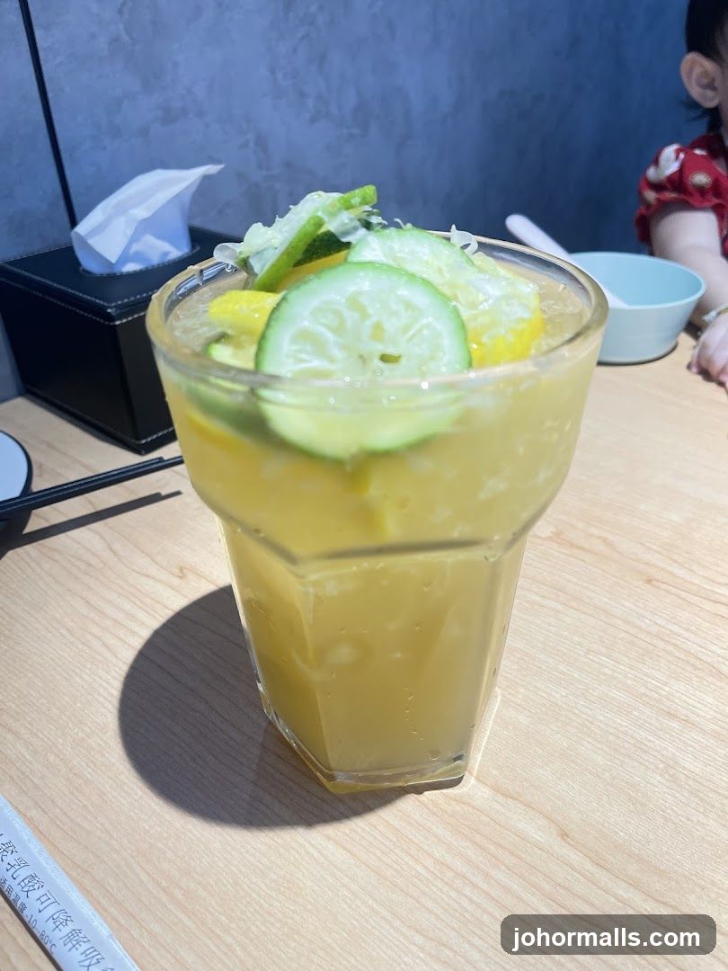 Yellow Drink with Citrus Garnish
