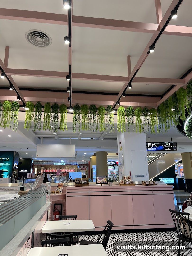 Cafe Interior with Pink Accents and Hanging Plants
