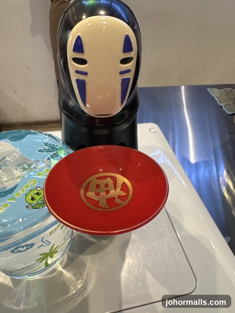 No-Face figurine and sake cup
