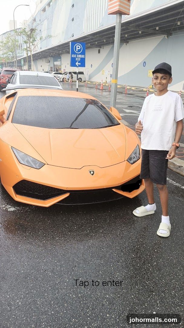 Boy with Orange Sports Car
