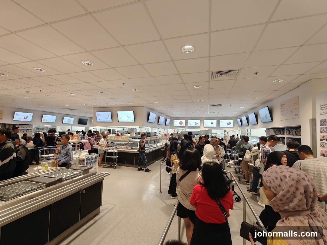 Busy cafeteria with people queuing