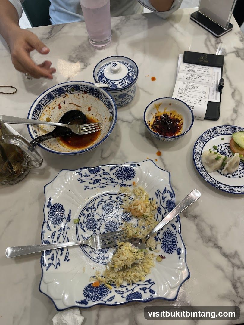 Table with leftover food and receipt