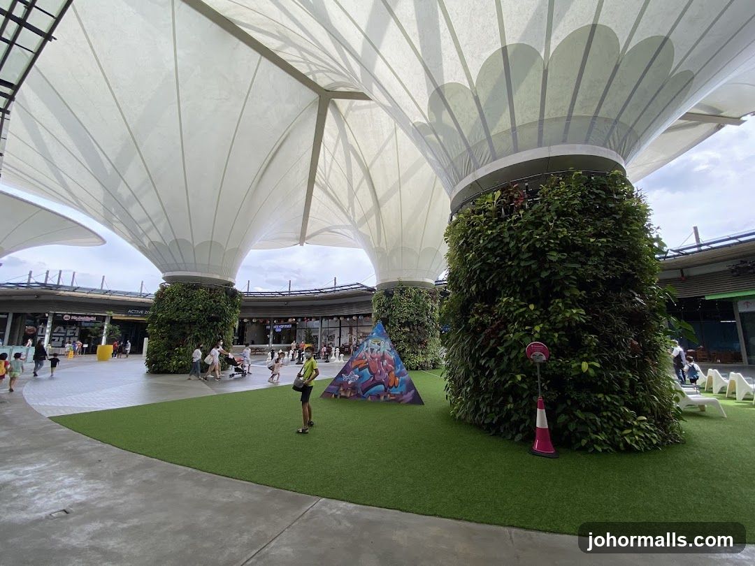Outdoor Plaza with Greenery and Play Area