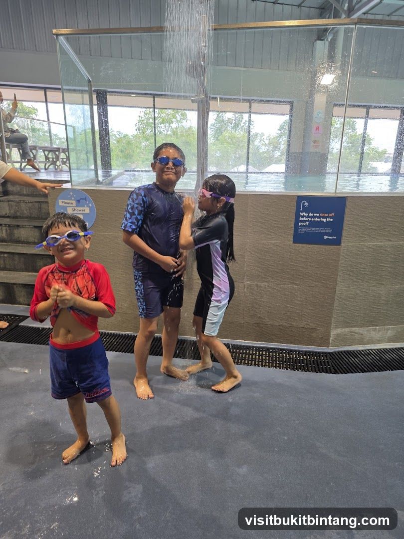 Children showering before entering pool