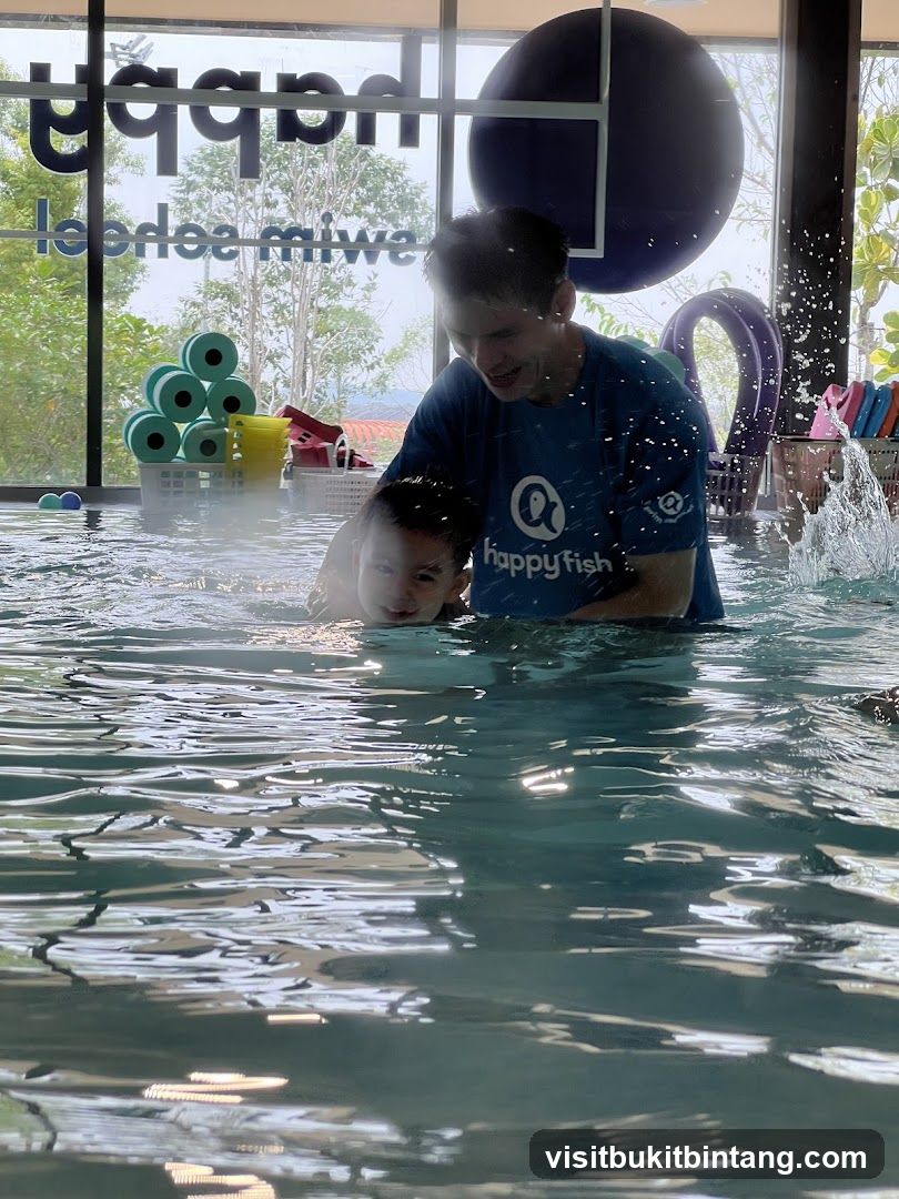 Swim instructor with child in pool