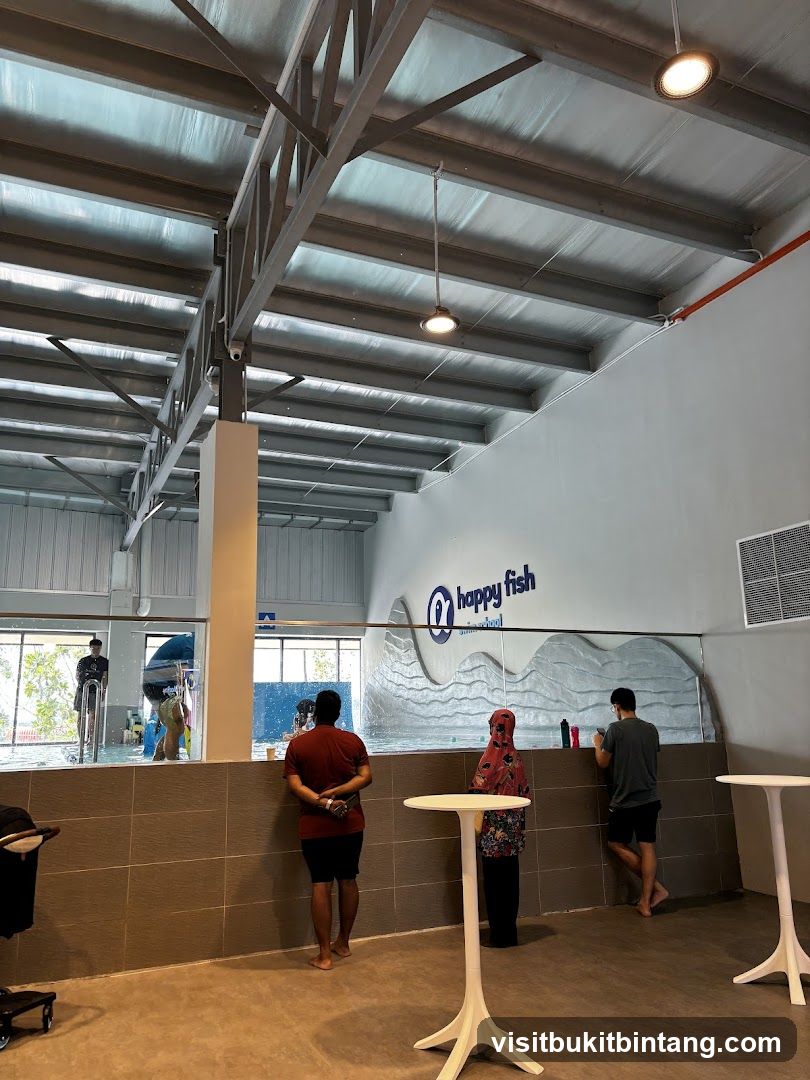 Indoor swimming pool area with seating