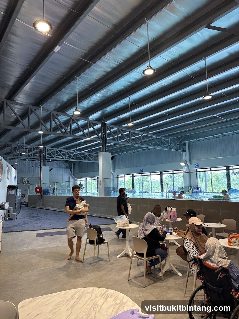 Indoor swimming pool area with seating