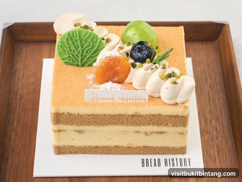 Square cake with fruit and cream decoration