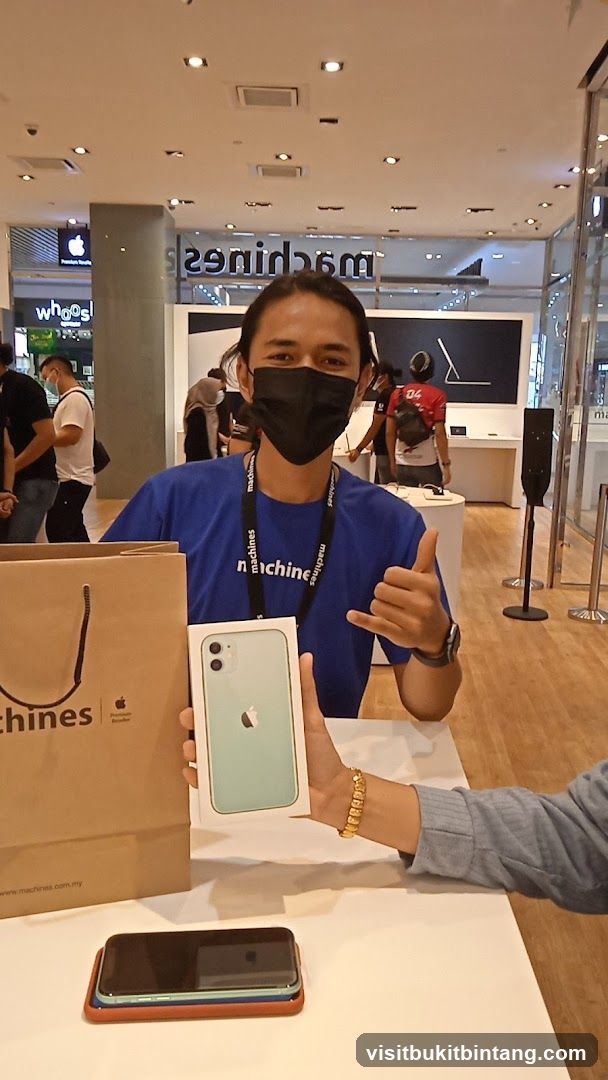 Salesperson holding an iPhone box