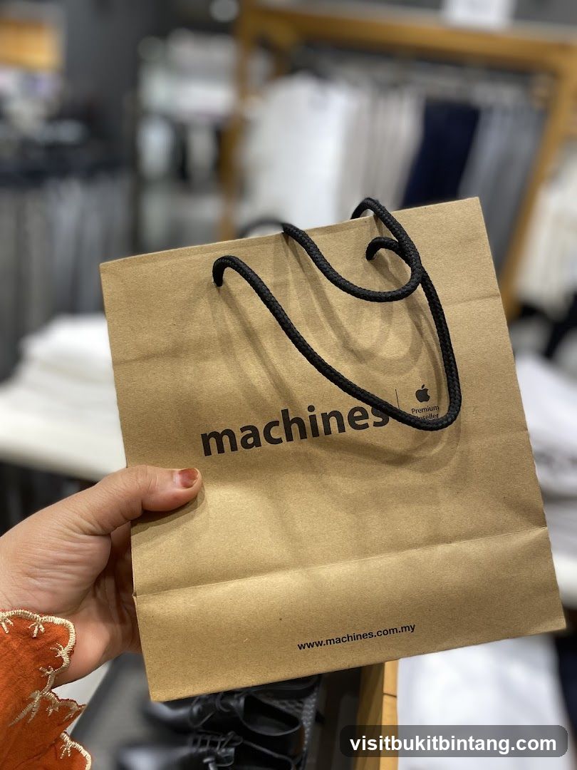 Brown paper shopping bag with "machines" logo