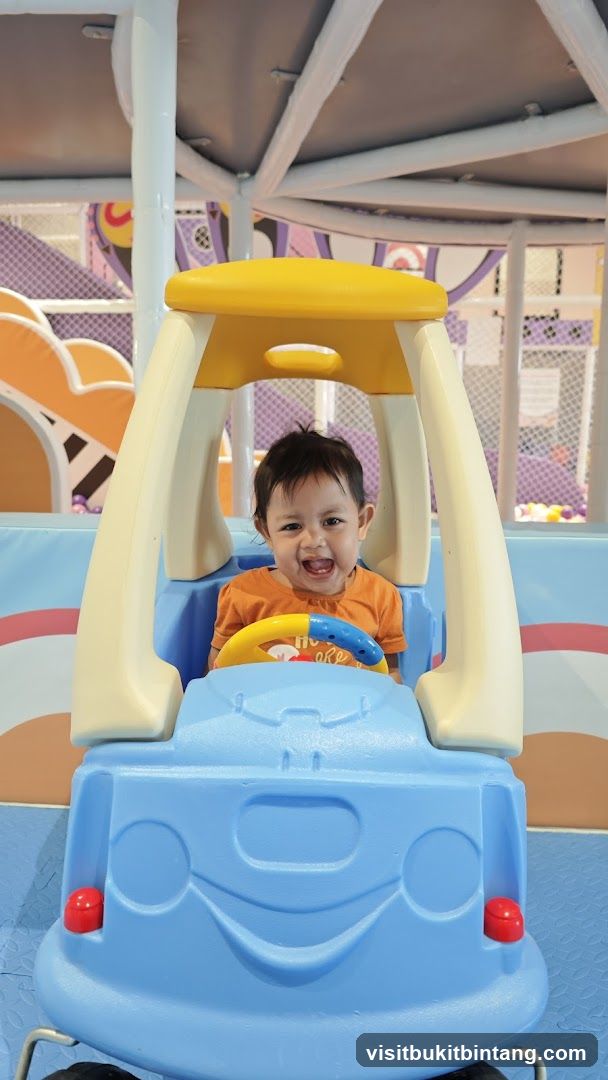 Child in Toy Car