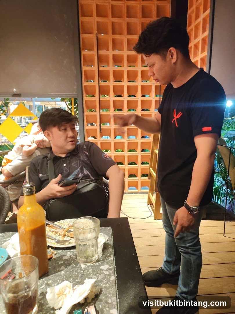 Two men talking at a table