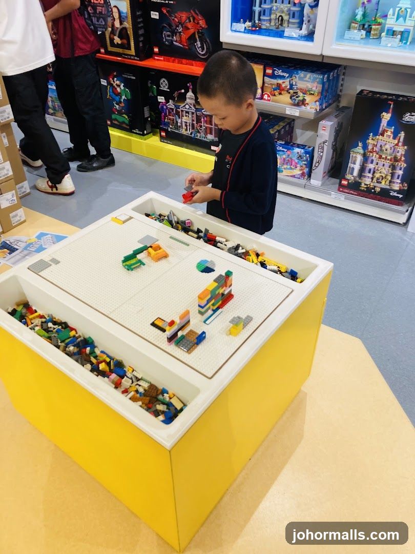 Child playing with LEGOs in a store