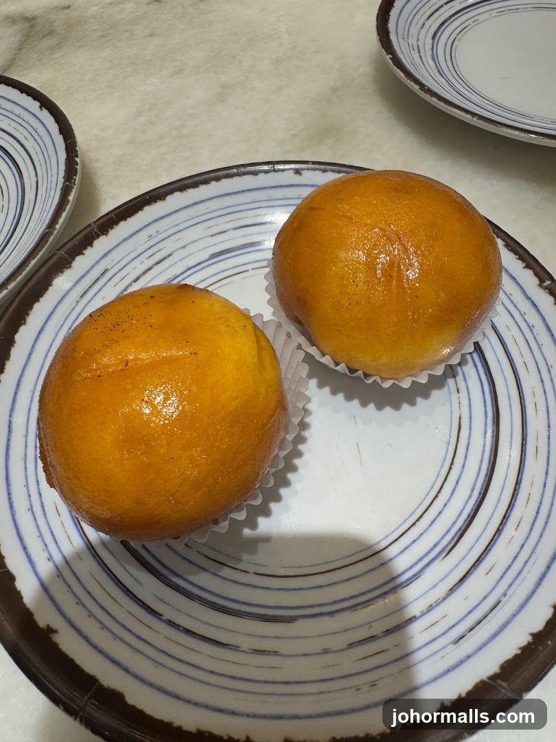 Two Golden Buns on a Plate