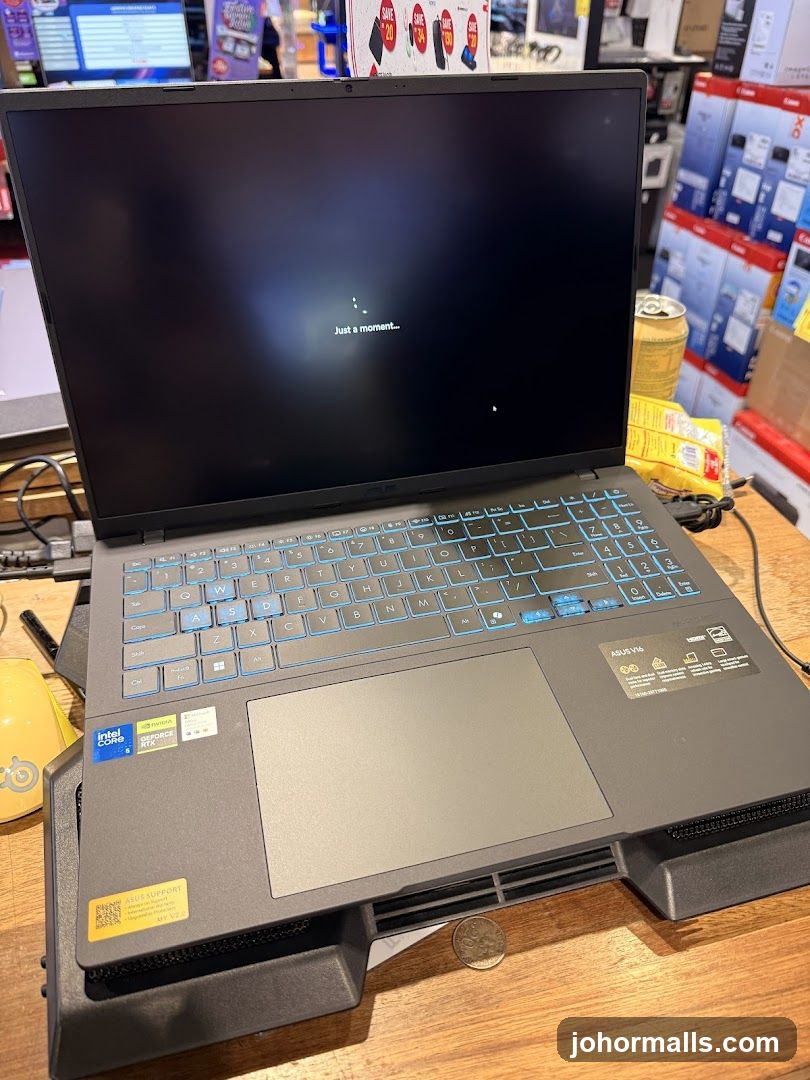 Laptop displaying "Just a moment..."