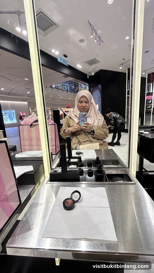 Woman taking a selfie in a makeup store