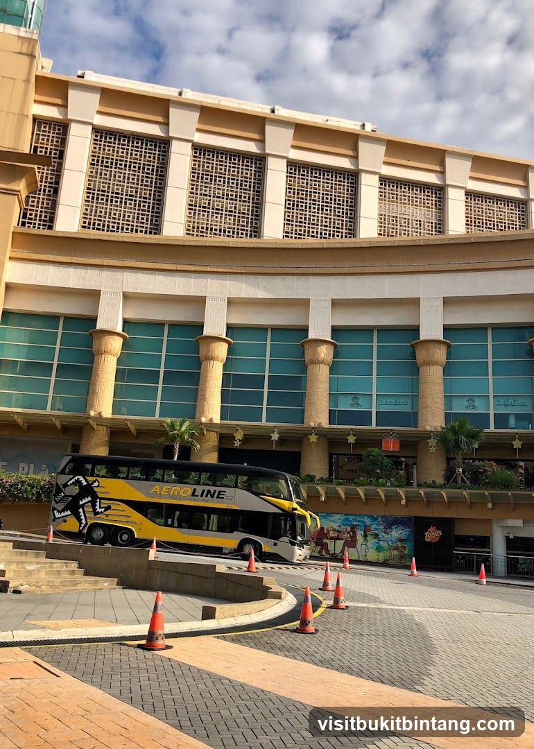Double-decker bus parked in front of a building