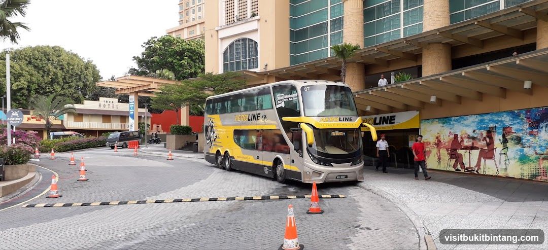 Double-decker bus at hotel entrance