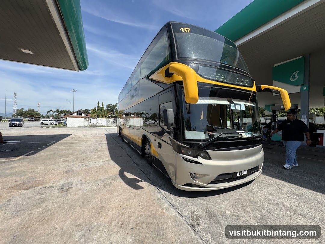 Double-decker bus at a gas station