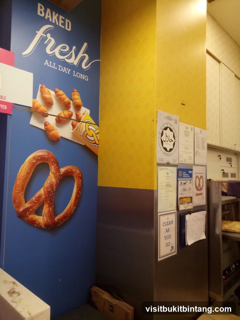 Pretzel shop interior with promotional art and certifications