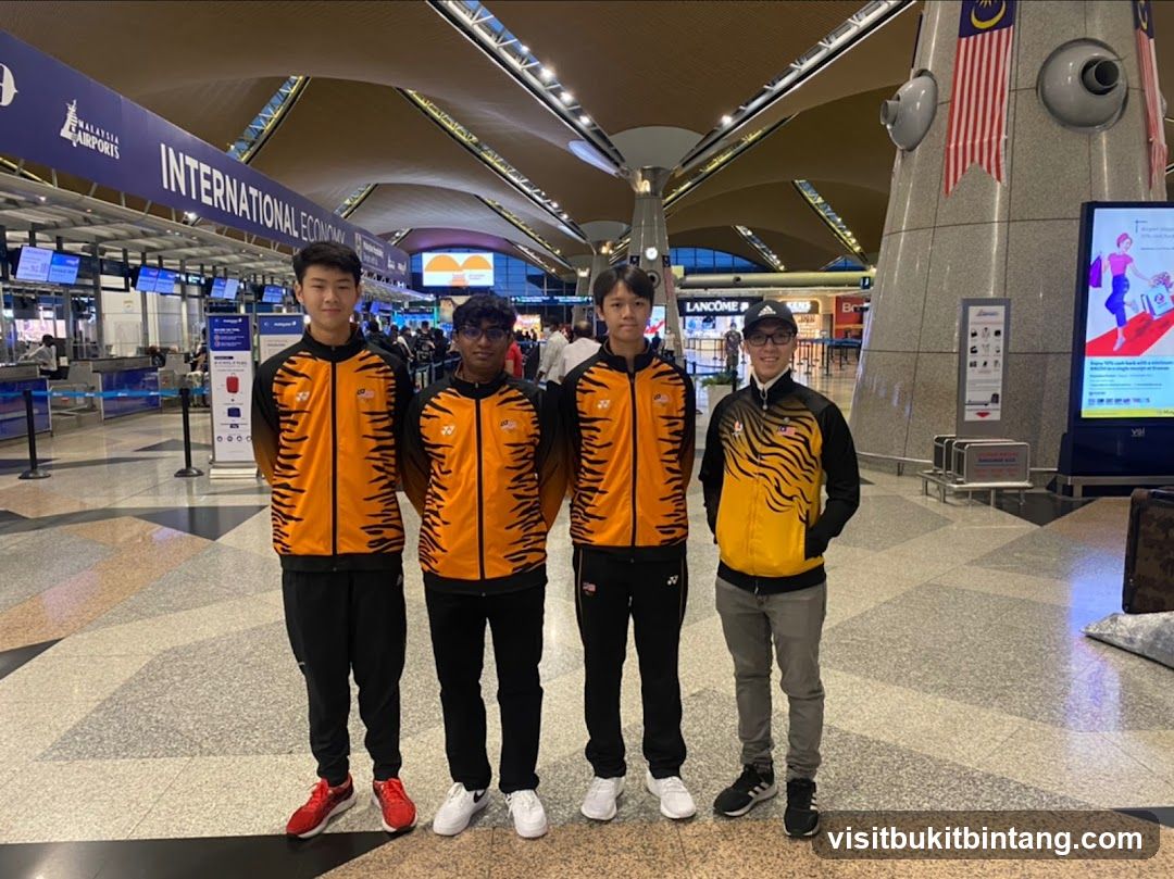Four young men in athletic wear