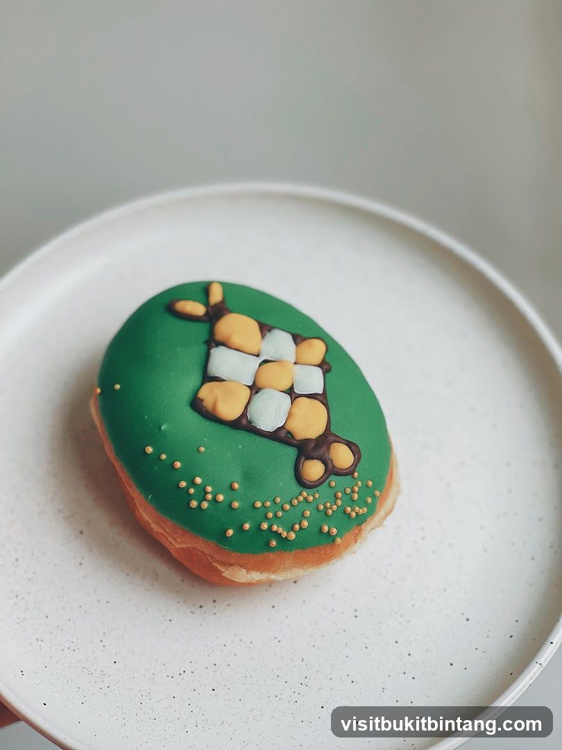 Donut with green icing and checkered pattern