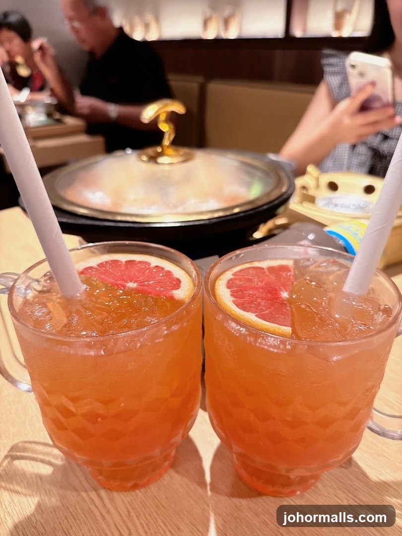 Two Grapefruit Drinks at a Table