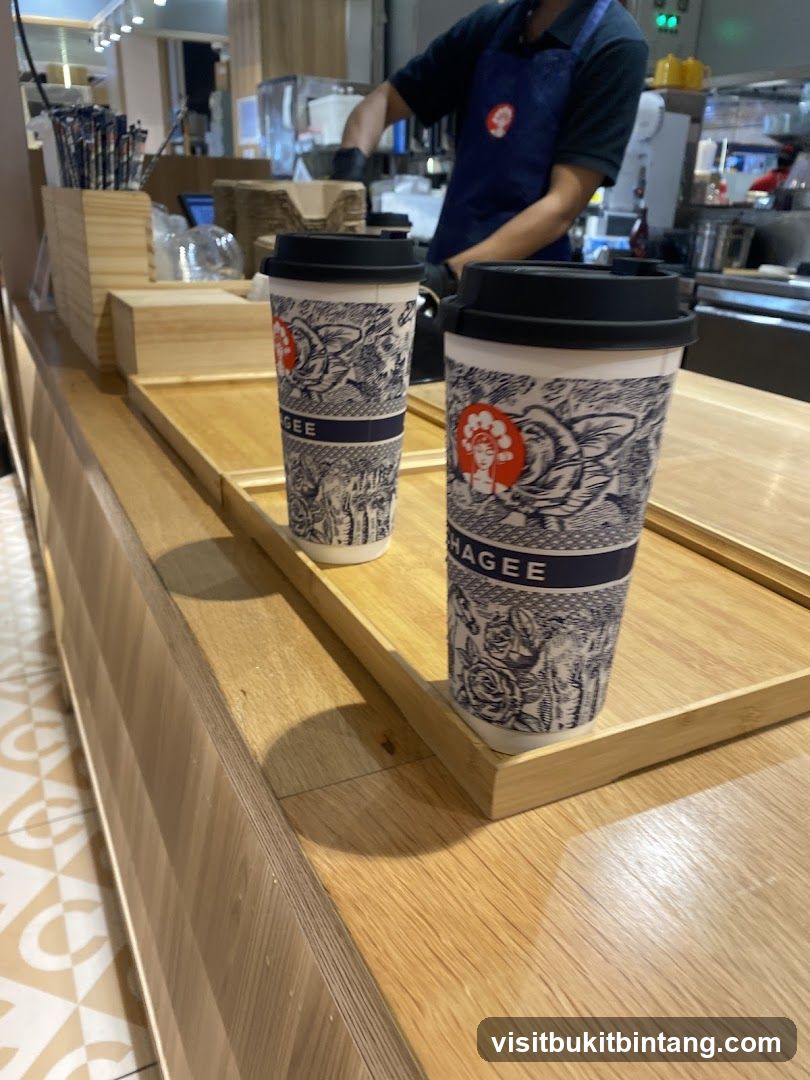Two coffee cups on a wooden counter