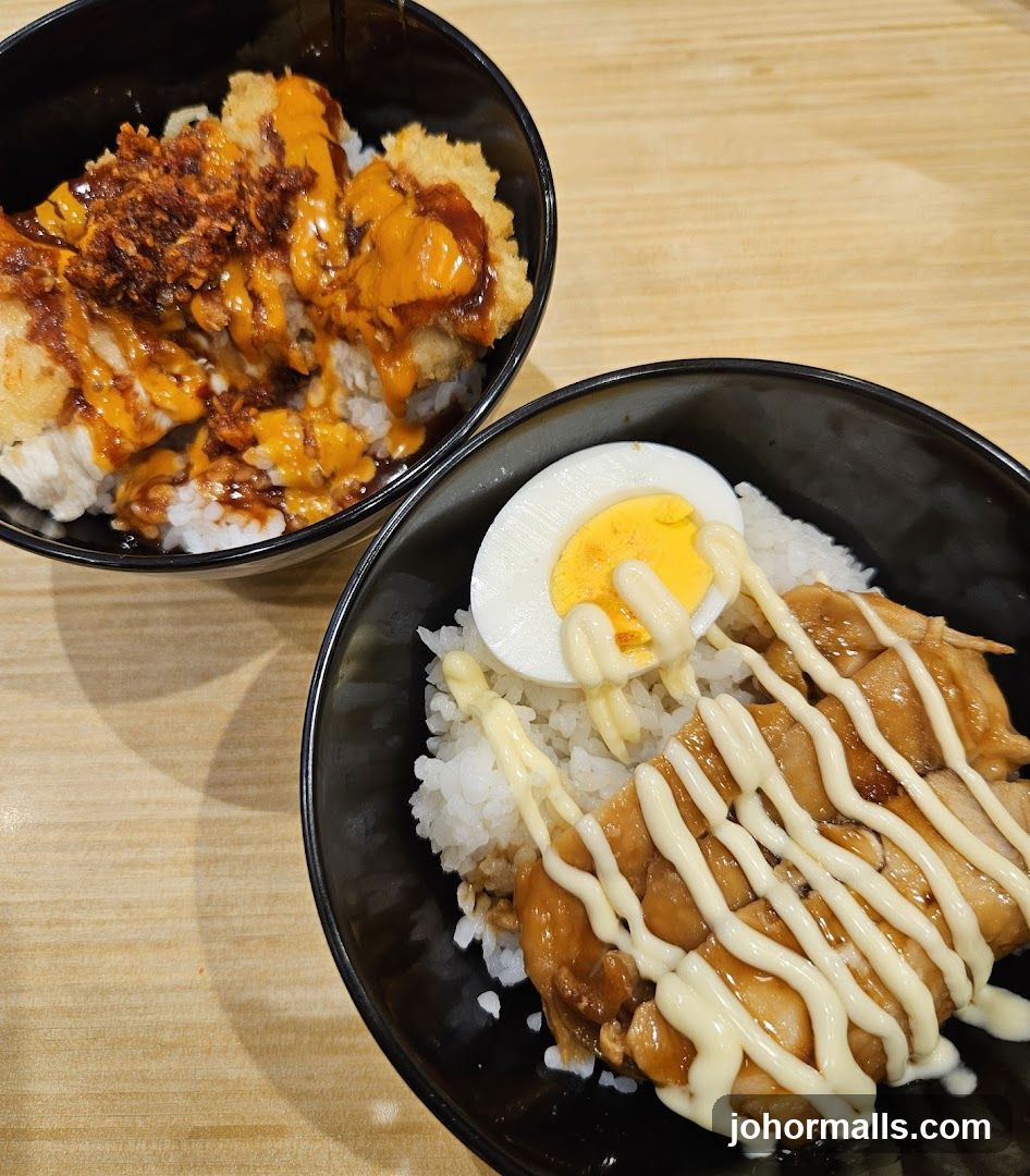 Two bowls of rice with toppings