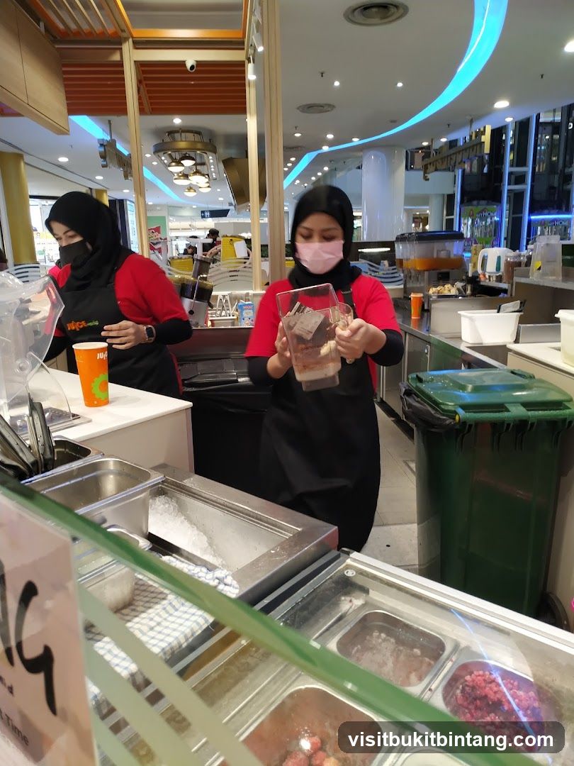 Juice Bar Staff Preparing Drinks