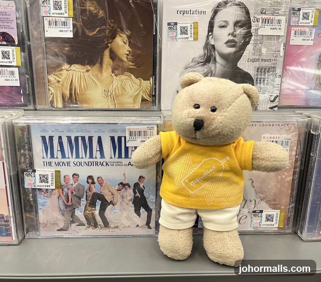 Teddy bear in front of CDs
