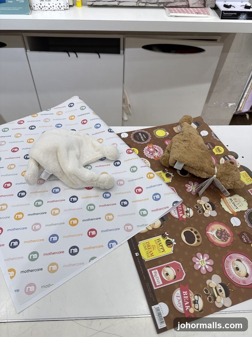 Mothercare branded wrapping paper and plush toys