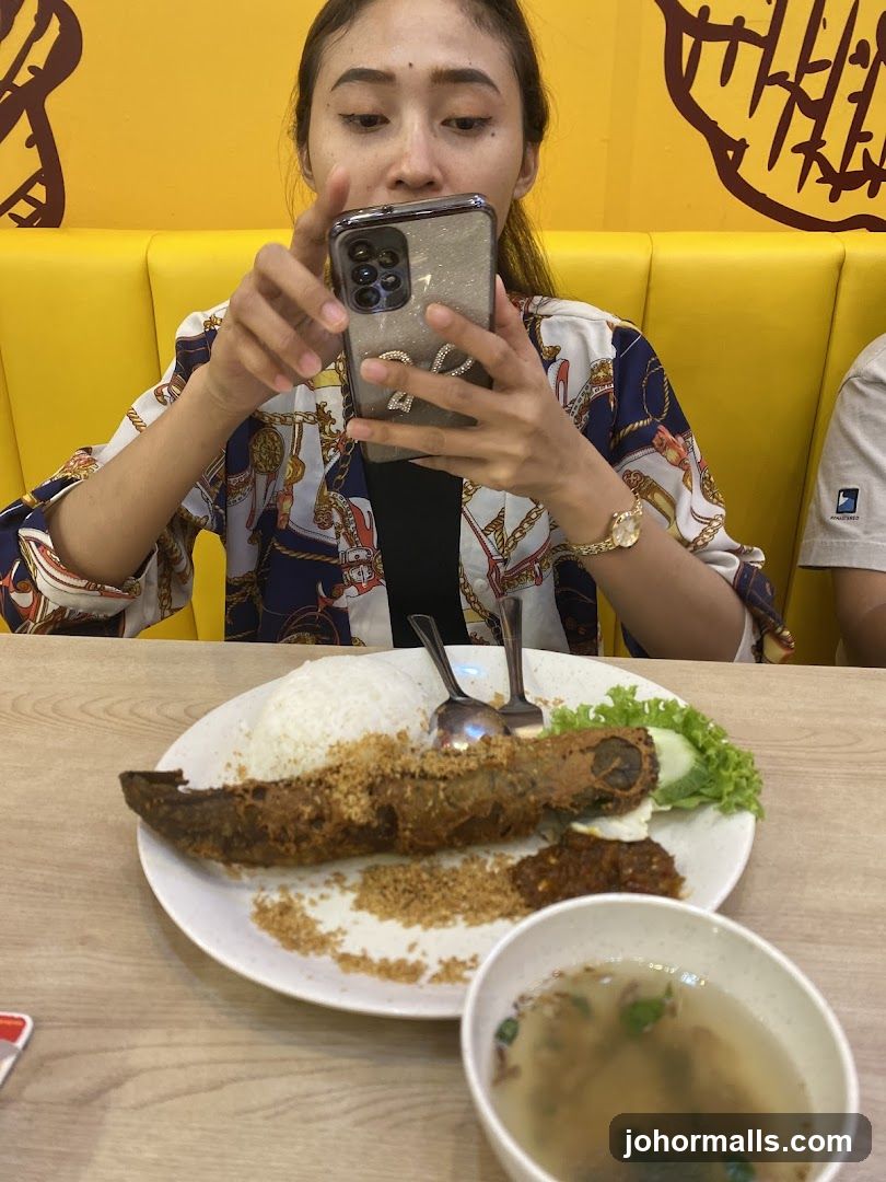Woman taking a photo of her meal