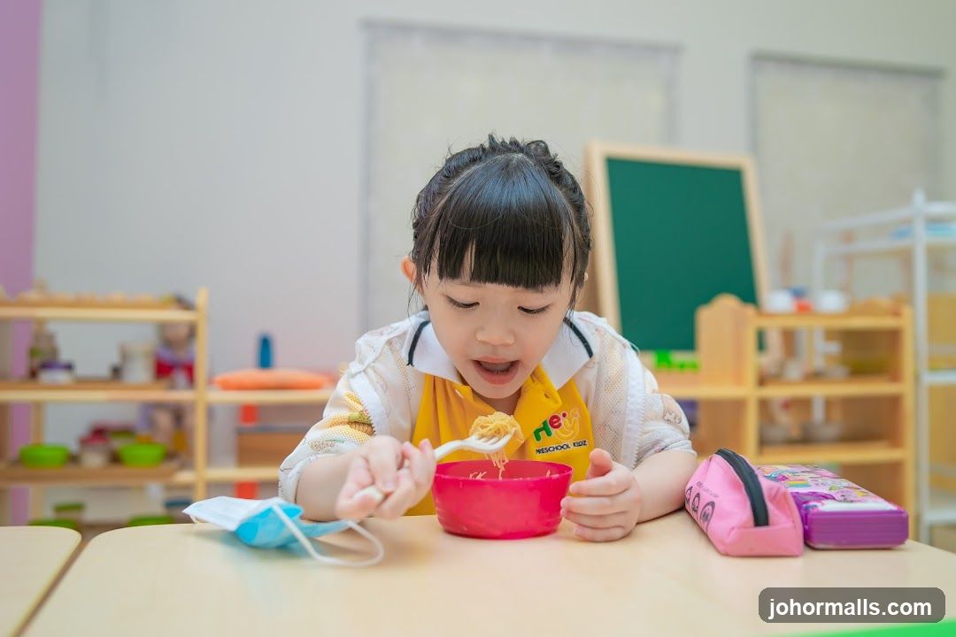 Young Girl Eating Noodles