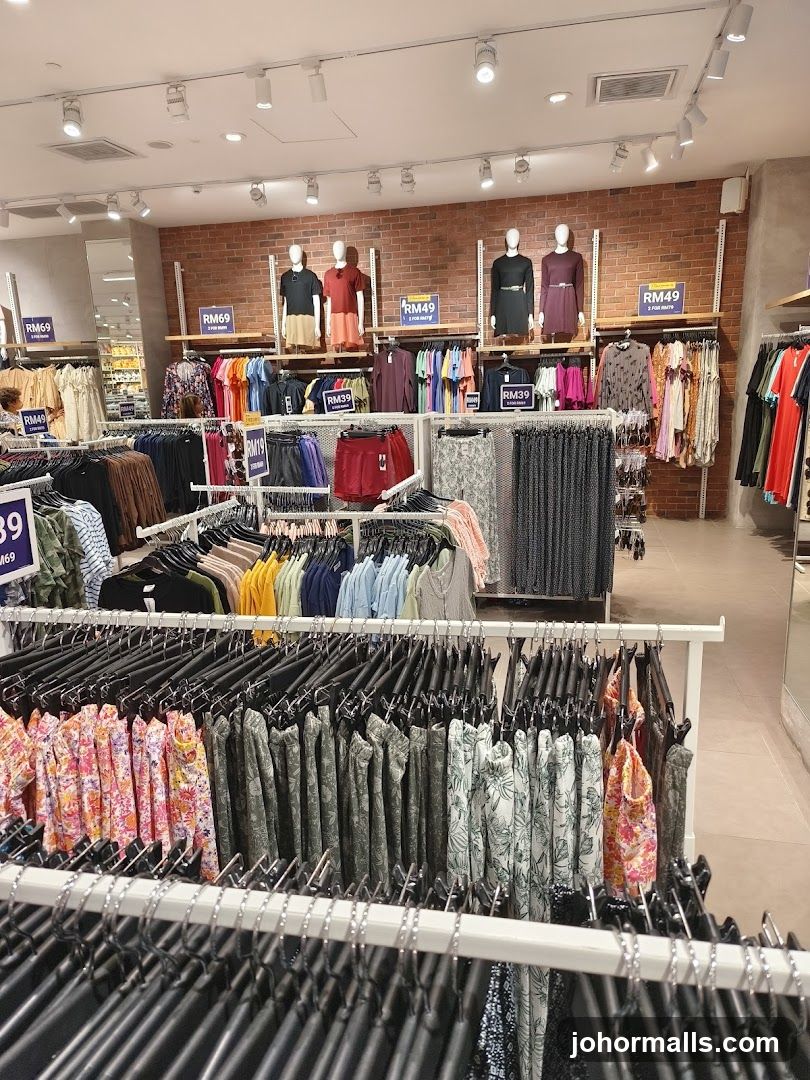 Clothing store interior with mannequins and racks of clothes