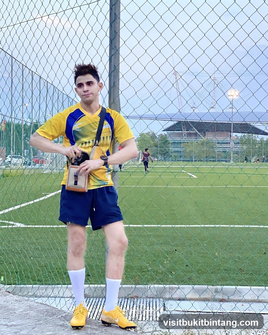 Man in Yellow Jersey at Soccer Field